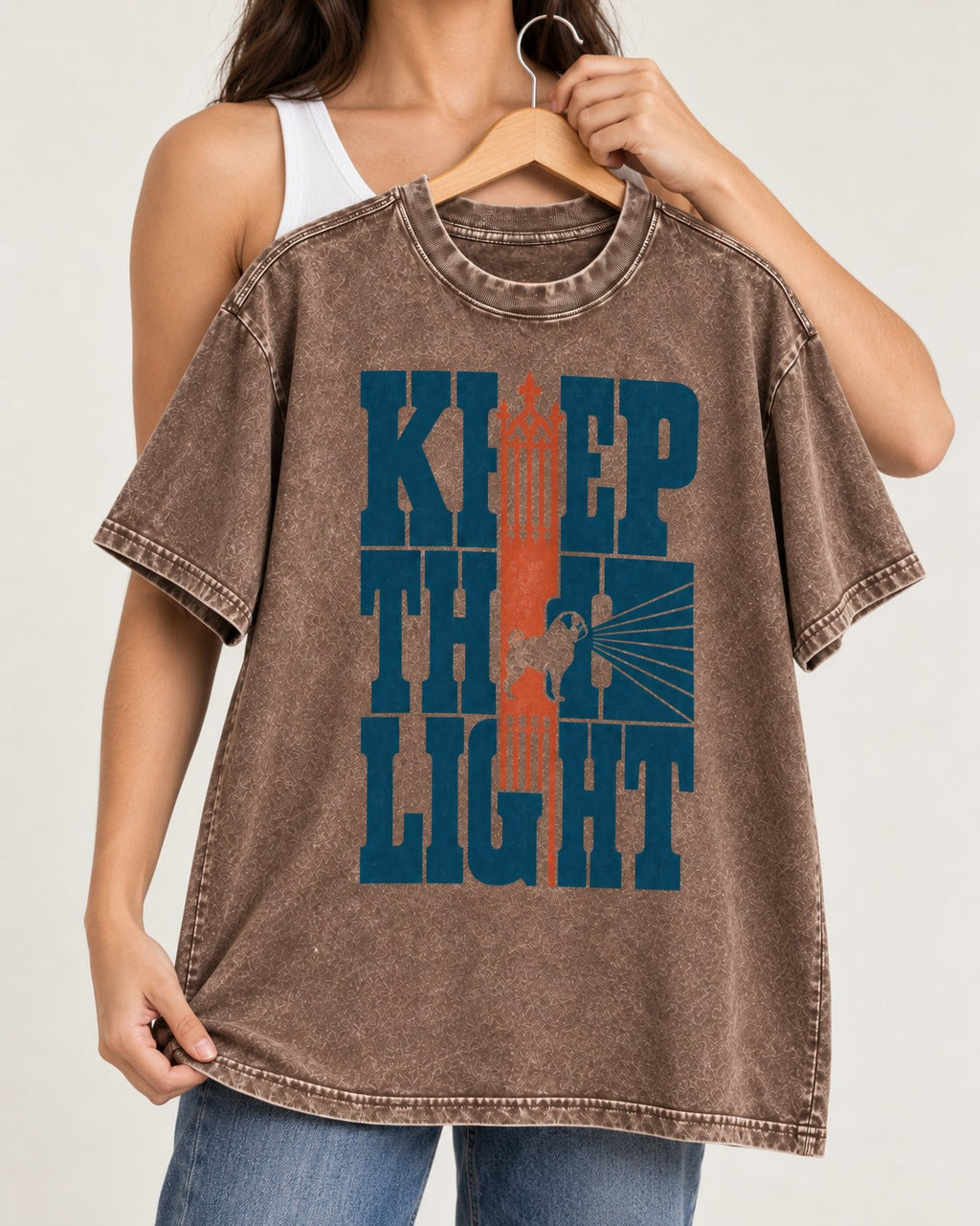 Keep the Pug Fight Washed Tee in Coffee, held up on a hanger