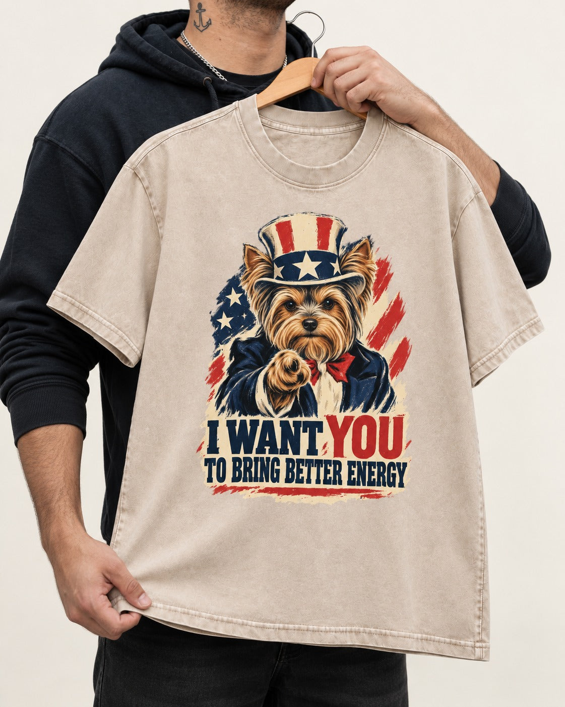 Yorkshire Terrier I Want You to Bring Better Energy Recruitment Poster Graphic Washed Tee in Apricot, held up on a hanger