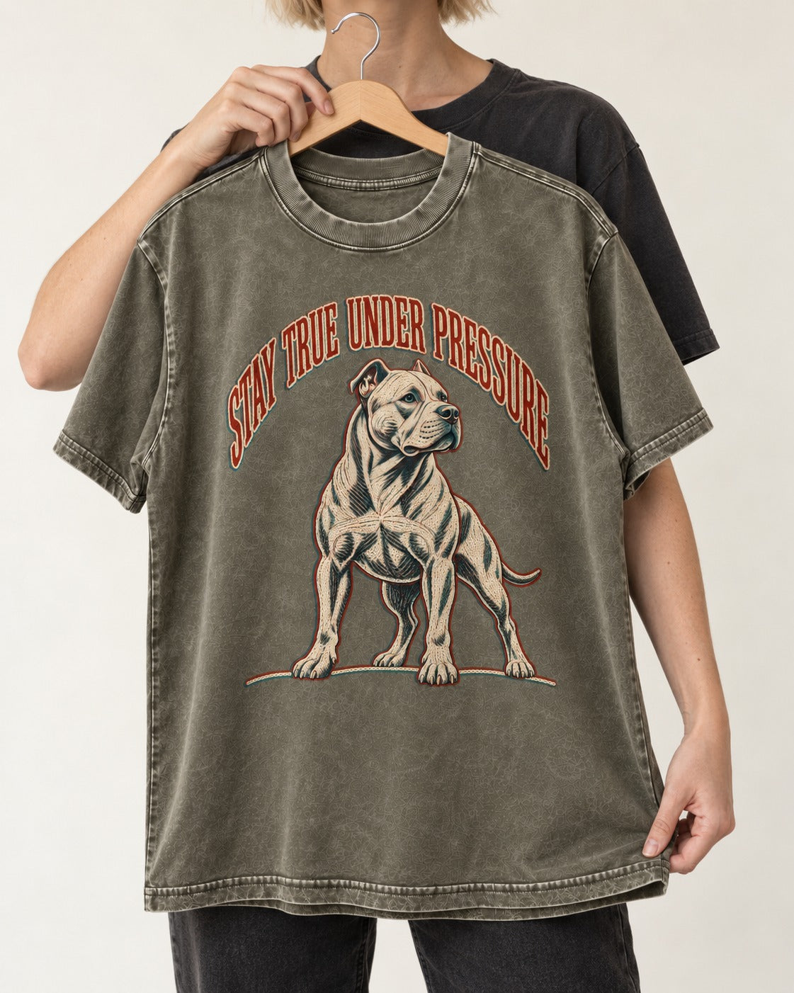 Pitbull Stay True Under Pressure Stance Graphic Washed Tee in Army Green, held up on a hanger
