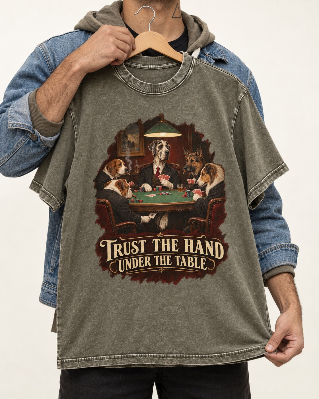Great Dane Trust the Hand Under the Table Poker Graphic Washed Tee in Army Green, held up on a hanger