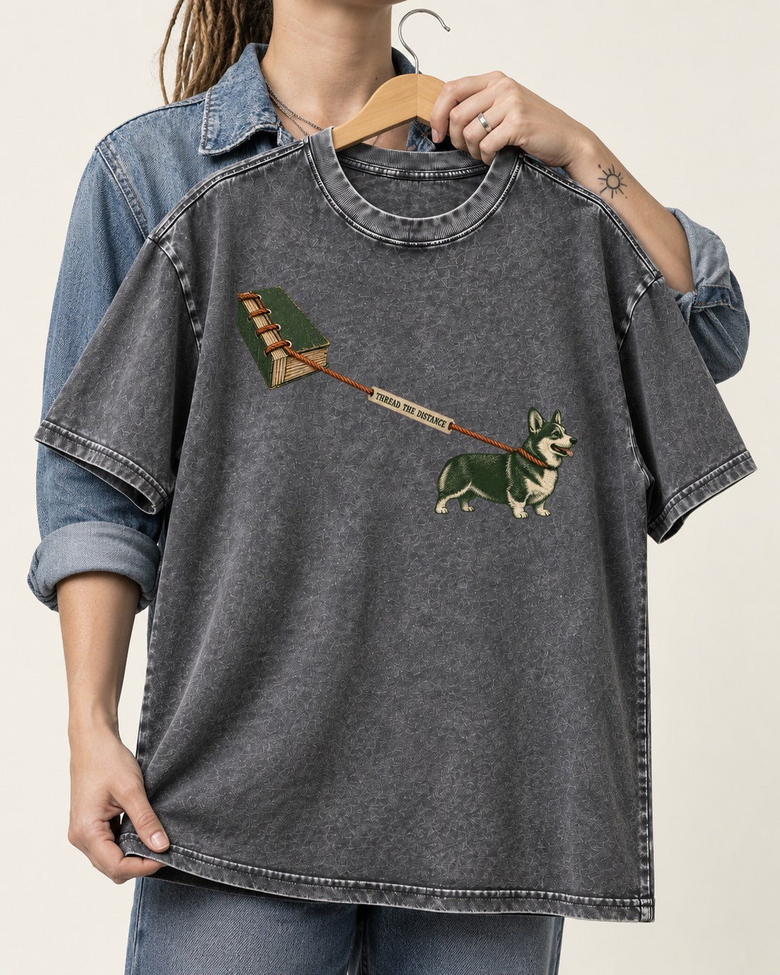 Thread the Distance with Corgi Washed Tee in Gray, held up on a hanger