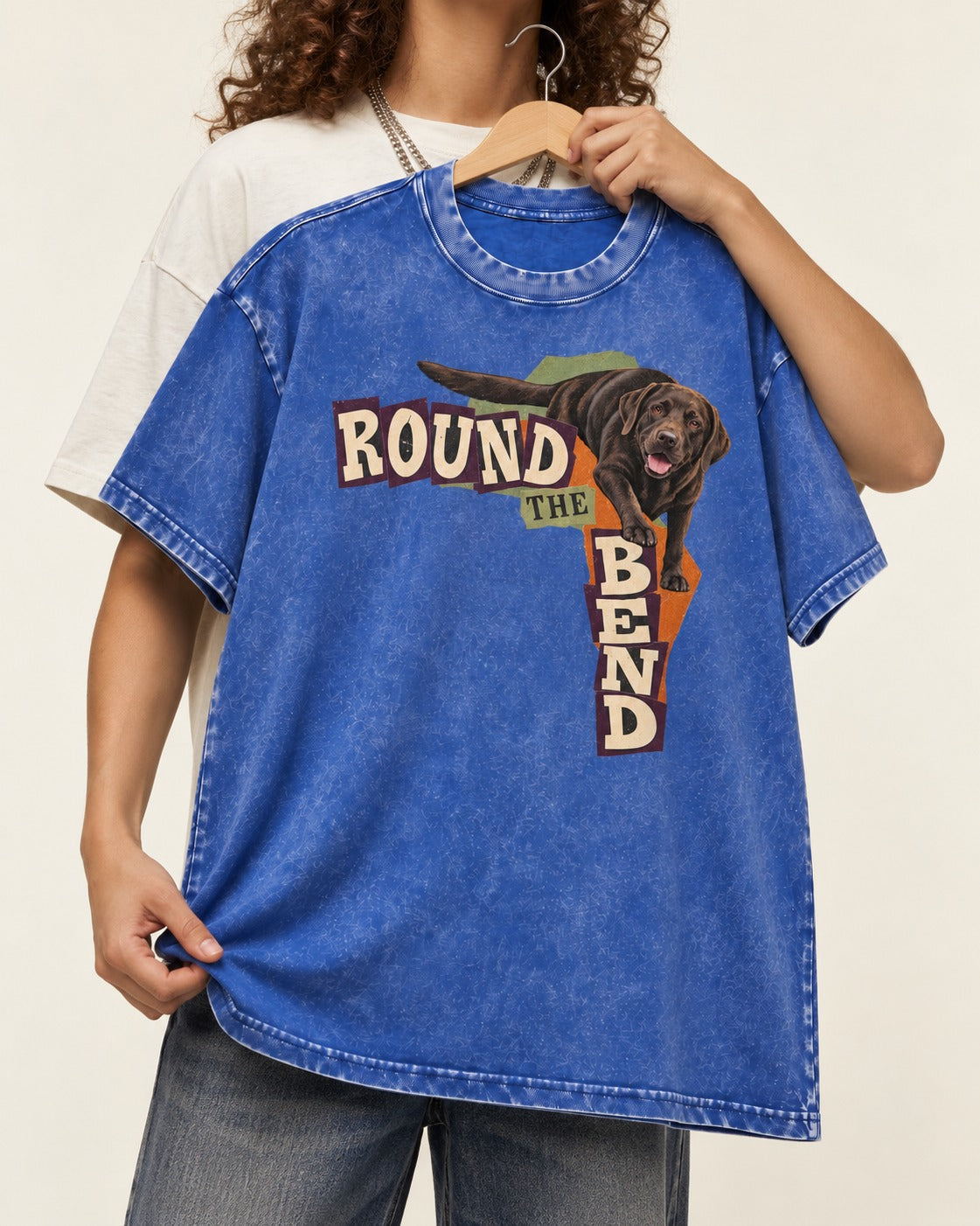 Labrador Retriever Round the Bend Collage Graphic Washed Tee in Royal Blue, held up on a hanger