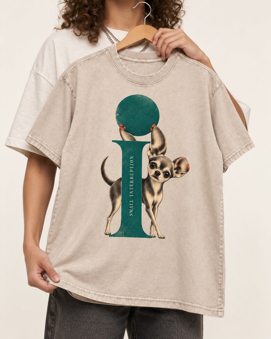 Chihuahua Small Interruption Geometric Portrait Washed Tee in Apricot, held up on a hanger