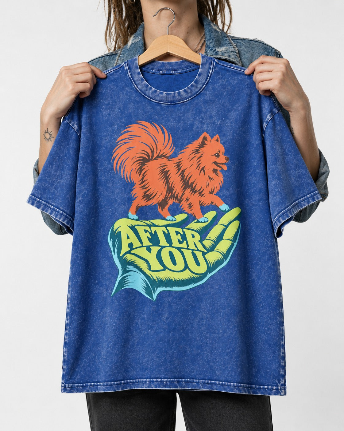 Pomeranian After You Helping Hand Graphic Washed Tee in Royal Blue, held up on a hanger