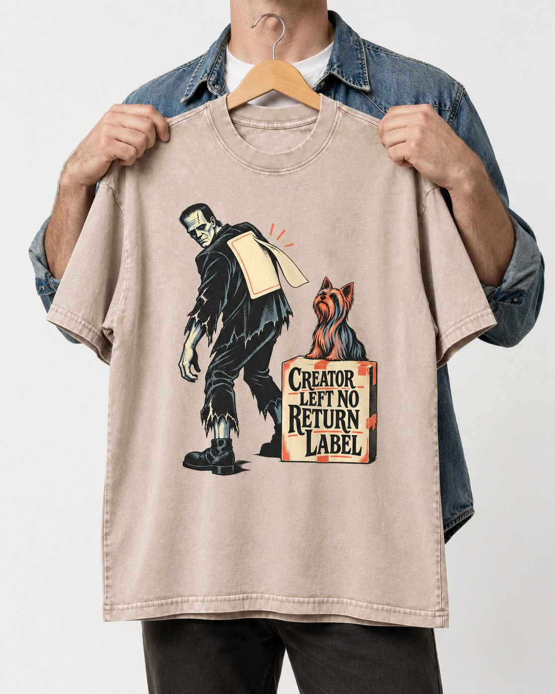 Yorkshire Terrier Creator Left No Return Label Monster Parcel Graphic Washed Tee in Apricot, held up on a hanger