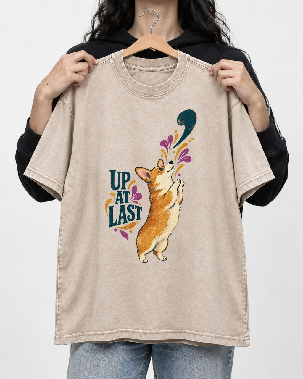 Corgi Up at Last Washed Tee in Apricot, held up on a hanger