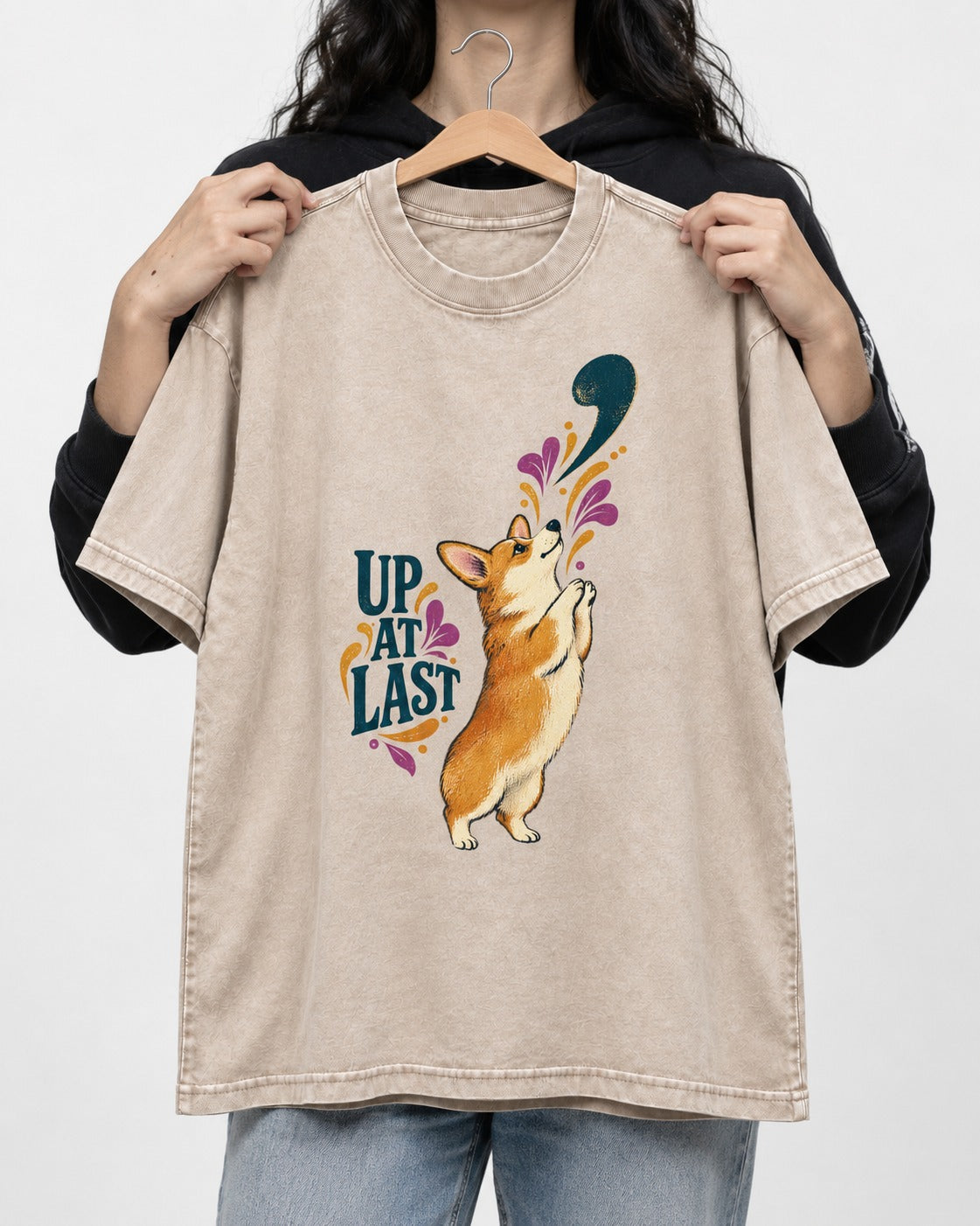 Corgi Up at Last Washed Tee in Apricot, held up on a hanger