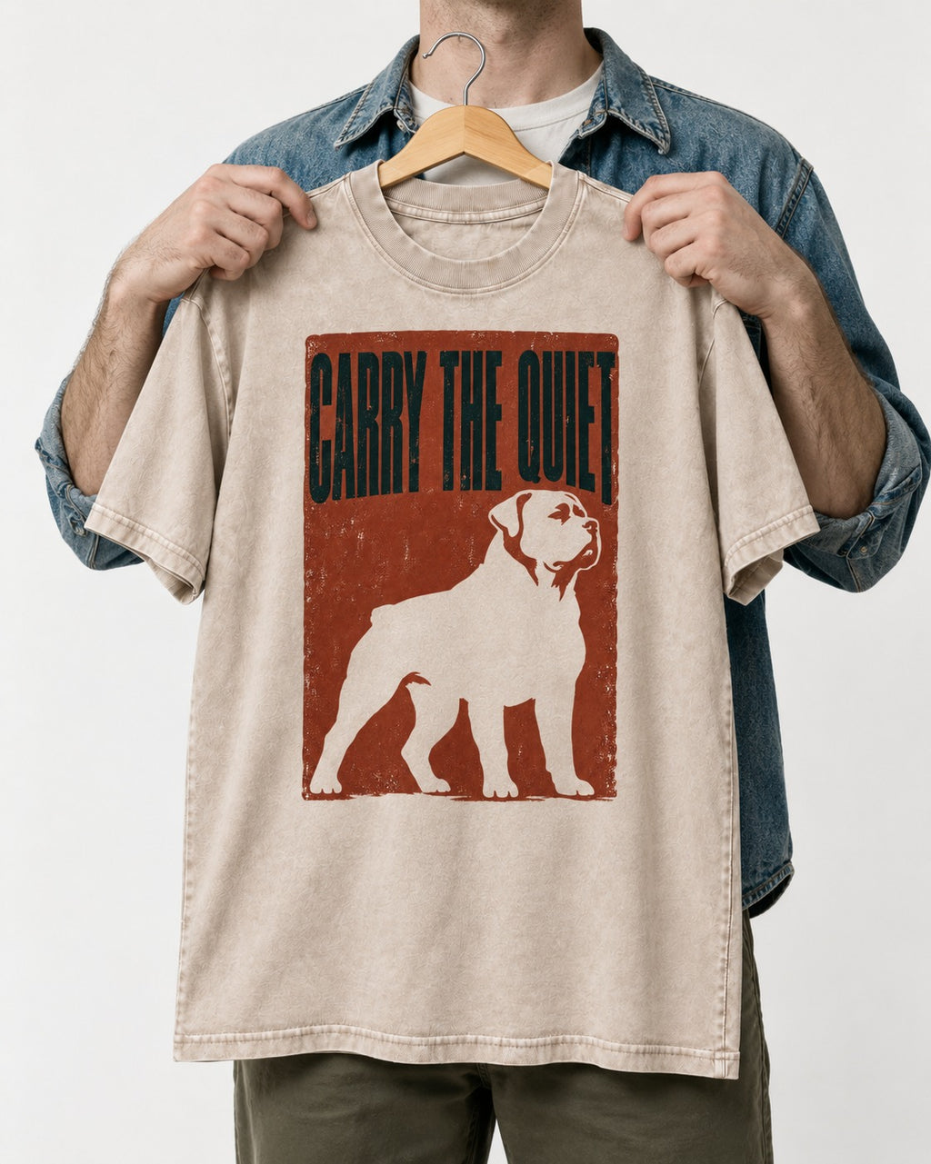 Rottweiler Carry the Quiet Washed Tee in Apricot, held up on a hanger