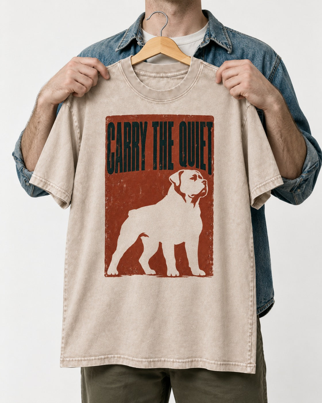 Rottweiler Carry the Quiet Washed Tee in Apricot, held up on a hanger