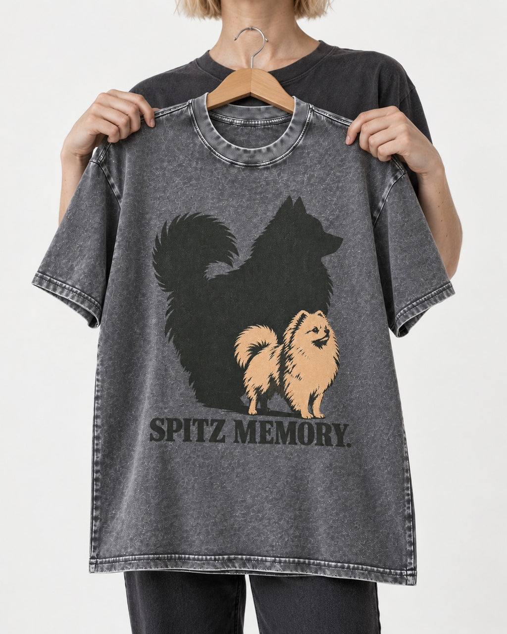 Pomeranian Spitz Memory Washed Tee in Gray, held up on a hanger