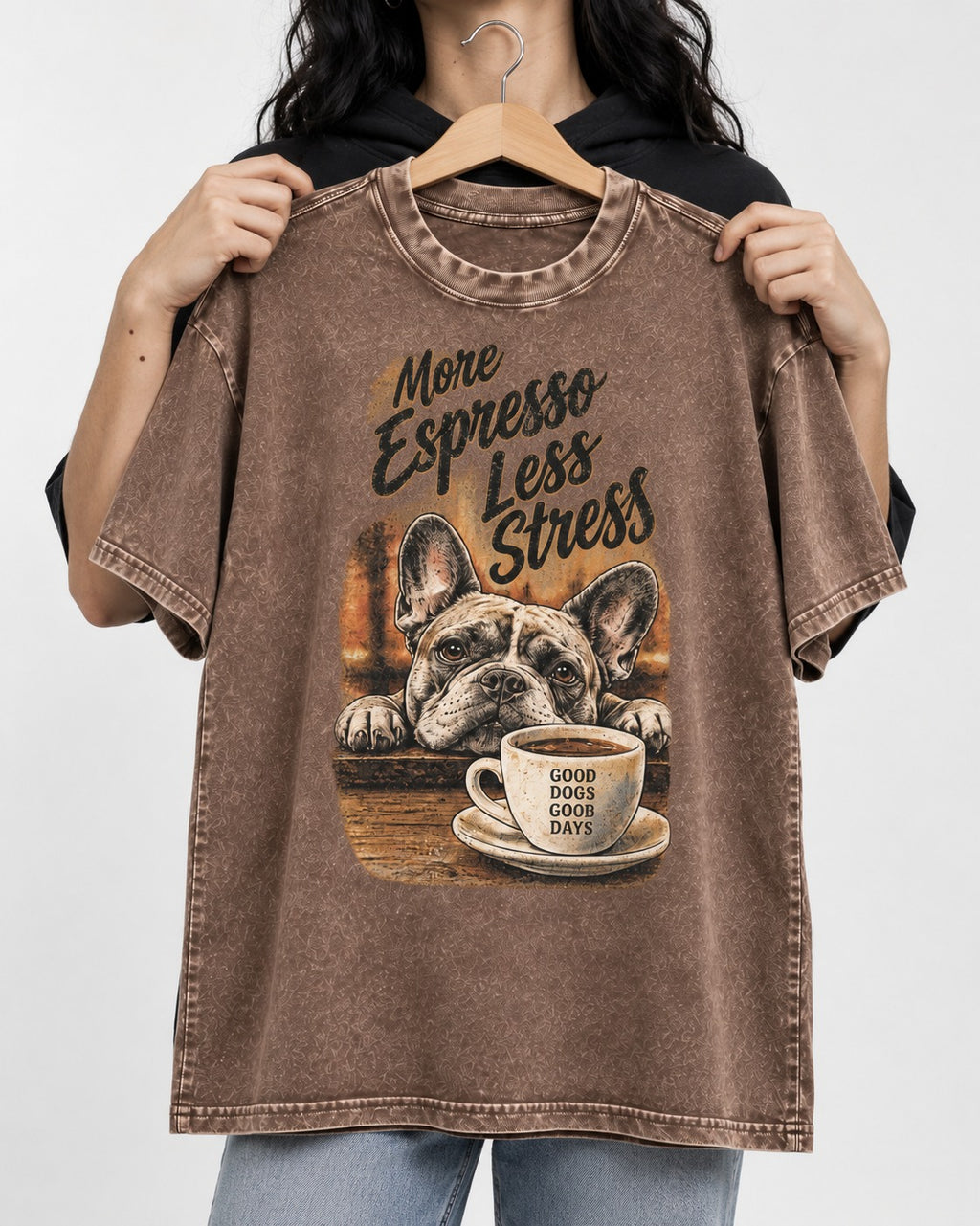 Frenchie More Espresso Less Stress Washed Tee in Coffee, held up on a hanger