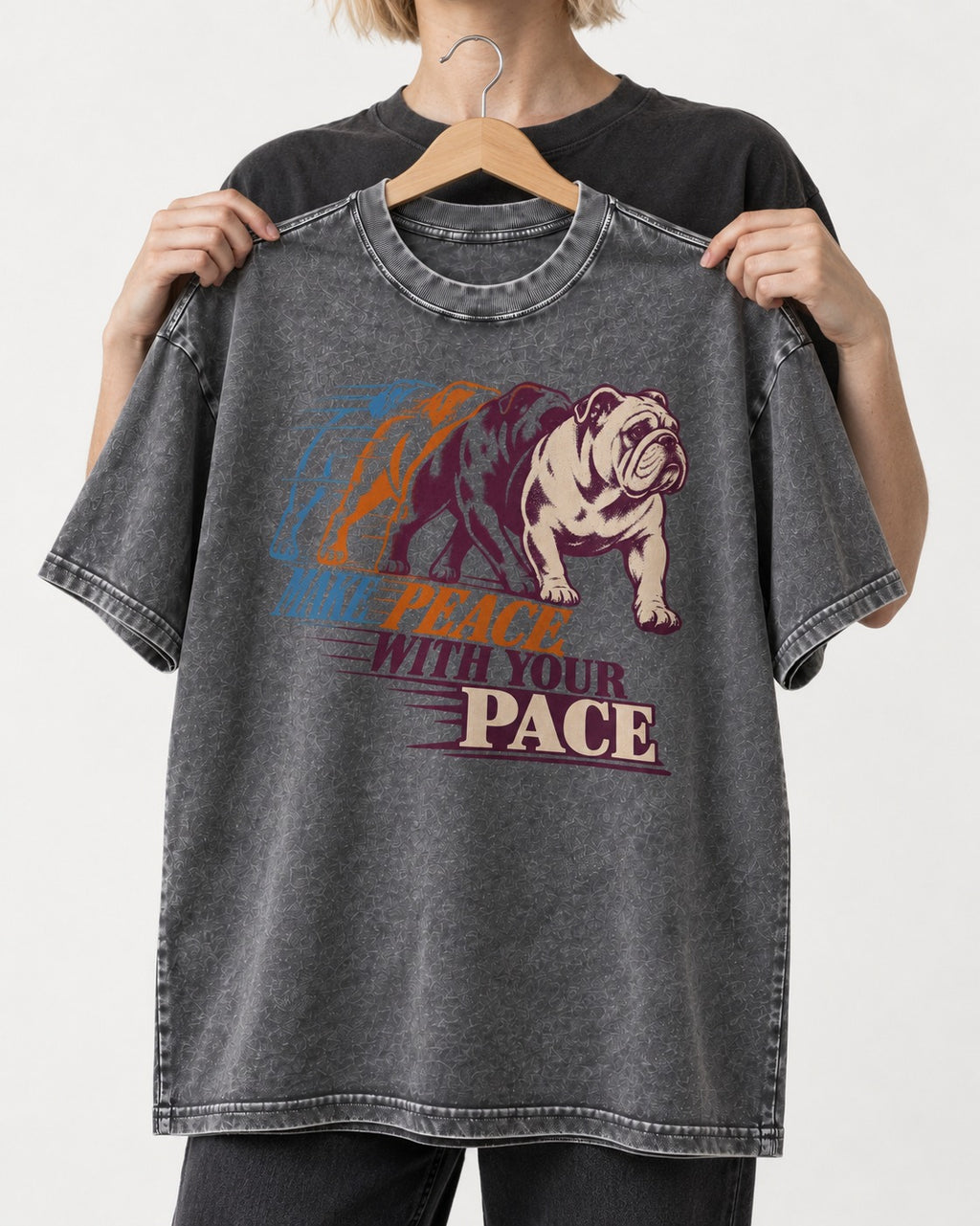 English Bulldog Peace with Your Pace Washed Tee in Gray, held up on a hanger