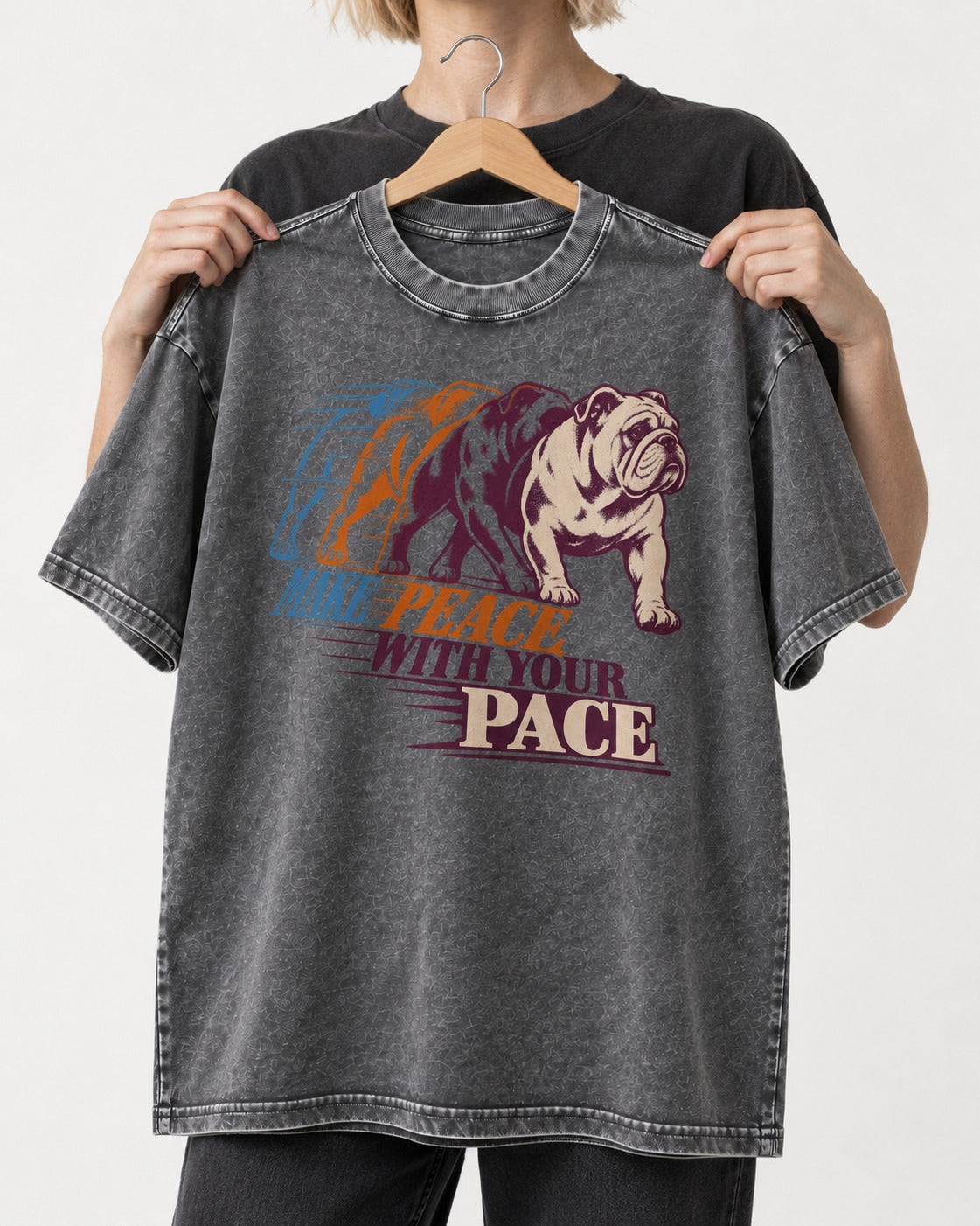 English Bulldog Peace with Your Pace Washed Tee in Gray, held up on a hanger