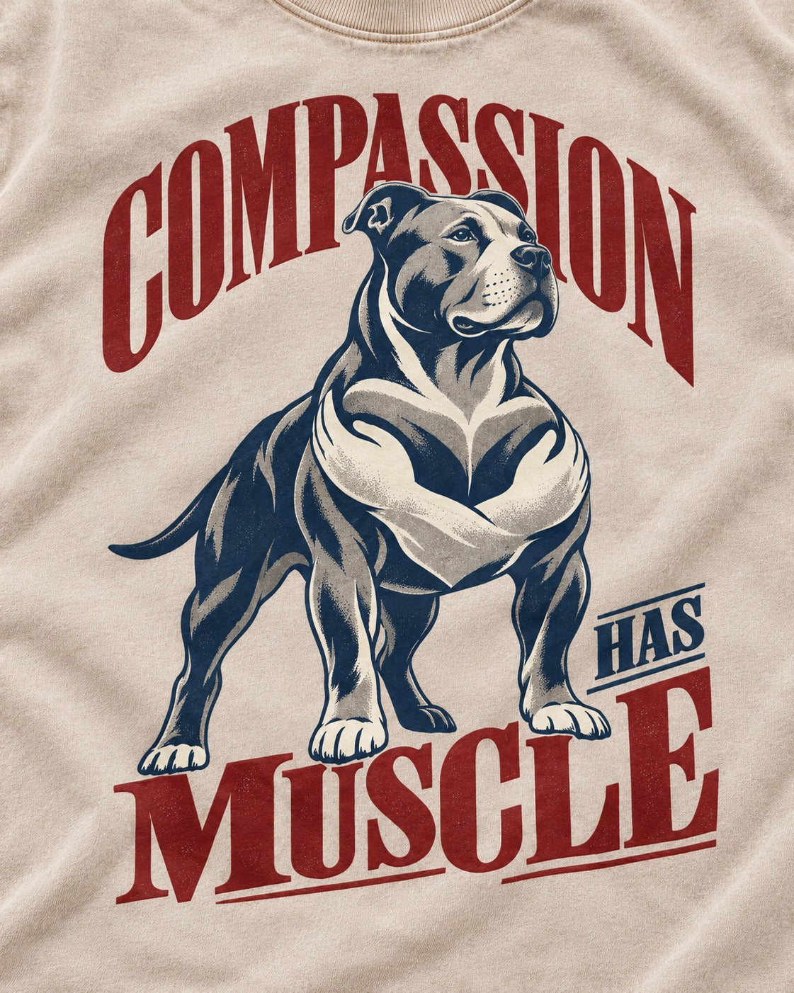 Pitbull Compassion Has Muscle Washed Tee in Apricot, close-up of the graphic
