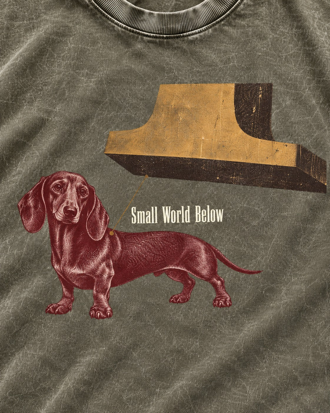 Dachshund Small World Below Giant Shoe Graphic Washed Tee in Army Green, close-up of the graphic