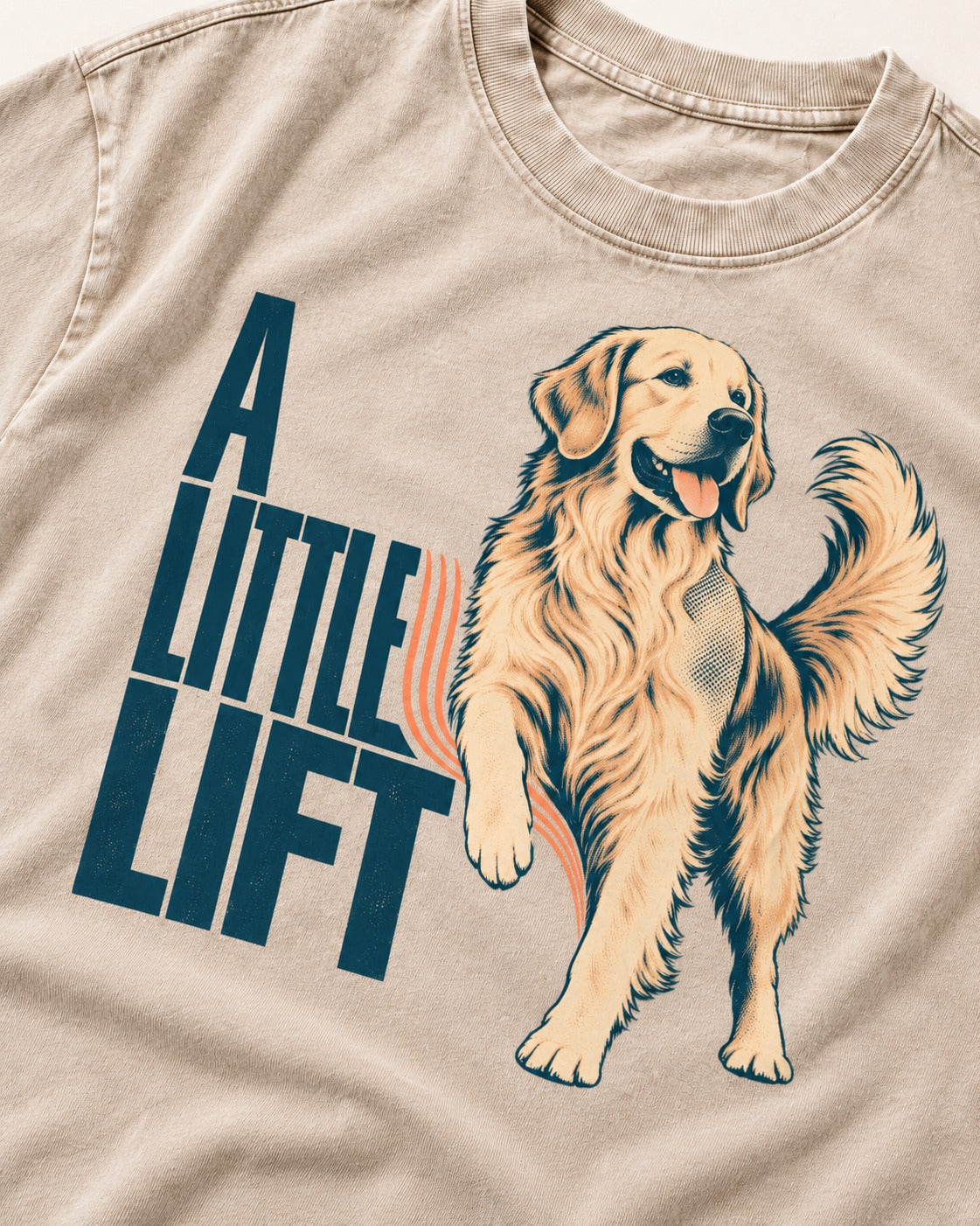 A Little Lift Golden Retriever Washed Tee in Apricot, close-up of the graphic