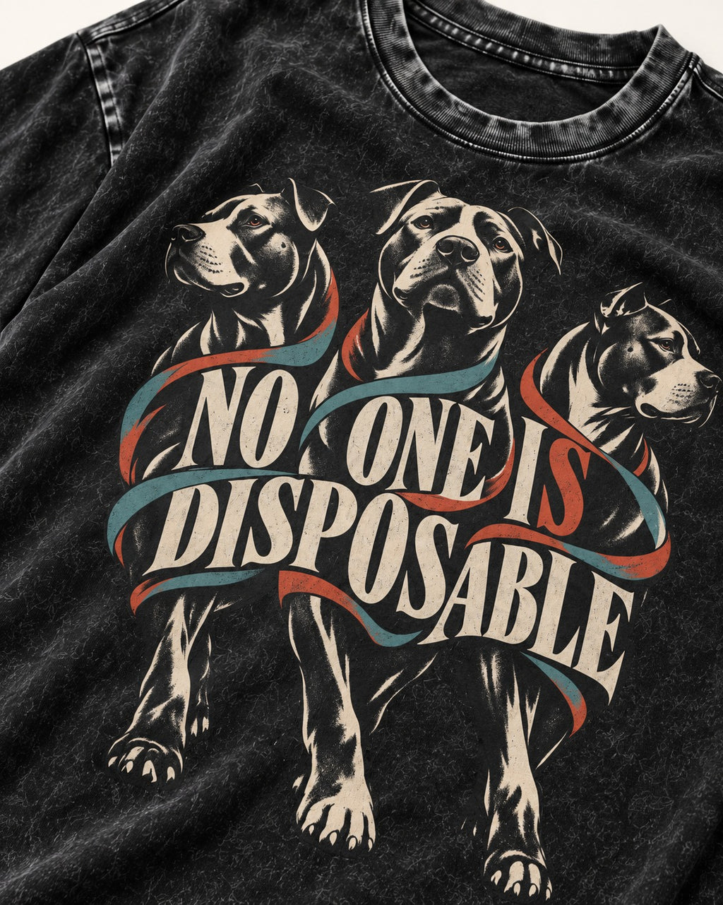 Pitbull No One Is Disposable Three Dogs Graphic Washed Tee in Black, close-up of the graphic