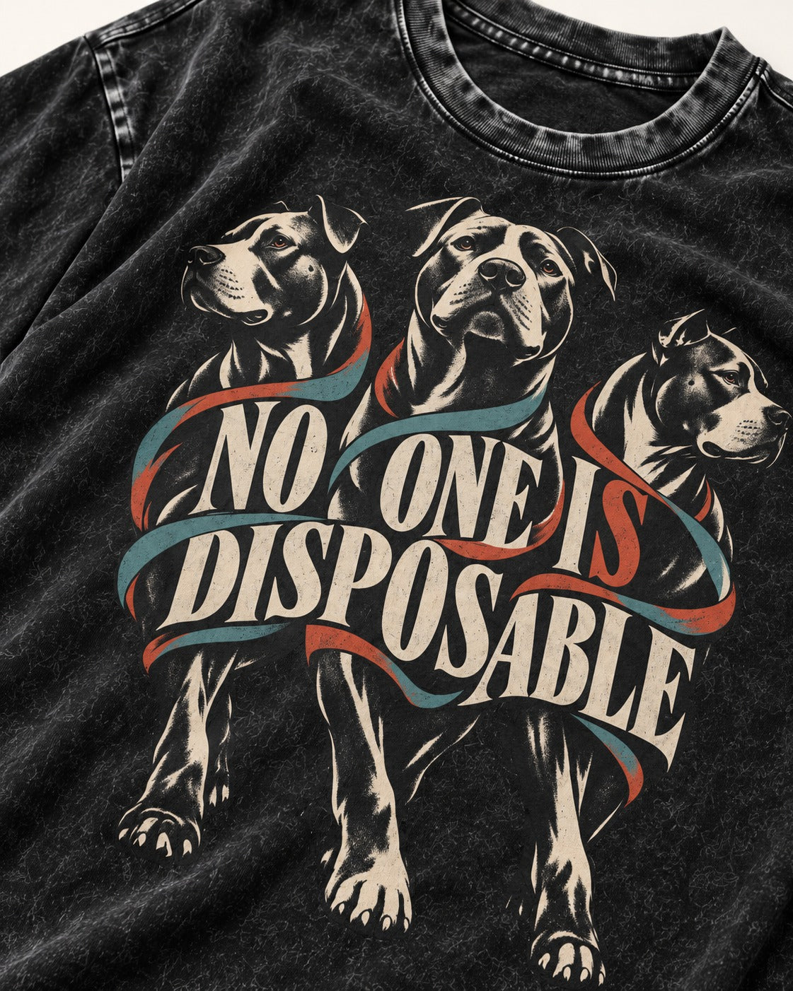Pitbull No One Is Disposable Three Dogs Graphic Washed Tee in Black, close-up of the graphic