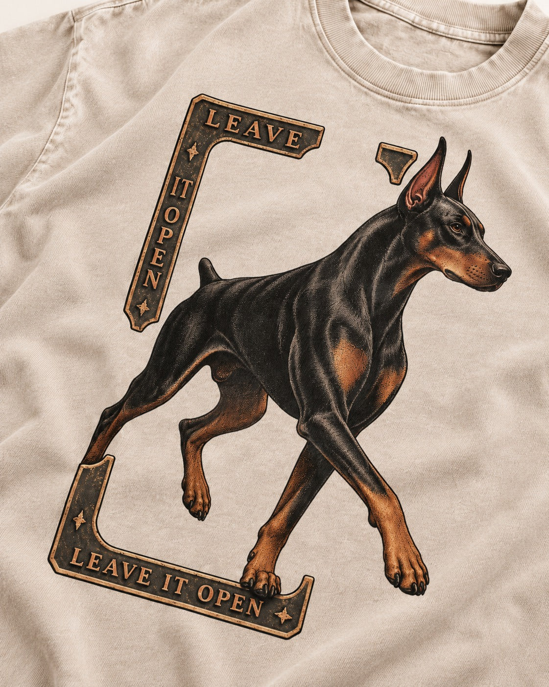 Leave It Open Doberman Washed Tee in Apricot, close-up of the graphic