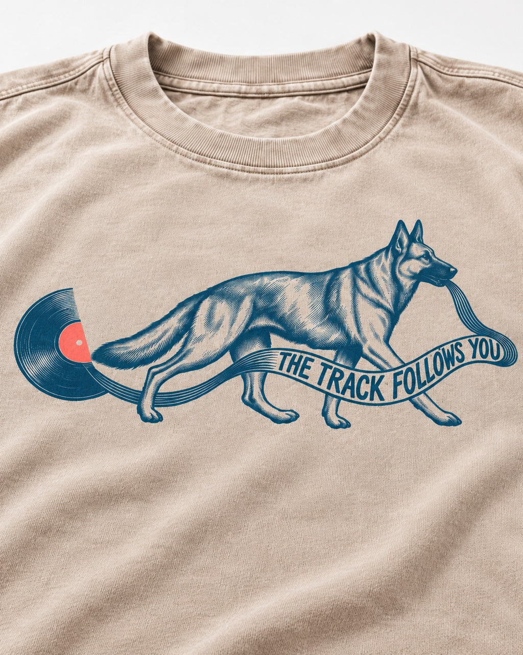 German Shepherd Dog The Track Follows You Washed Tee in Apricot, close-up of the graphic