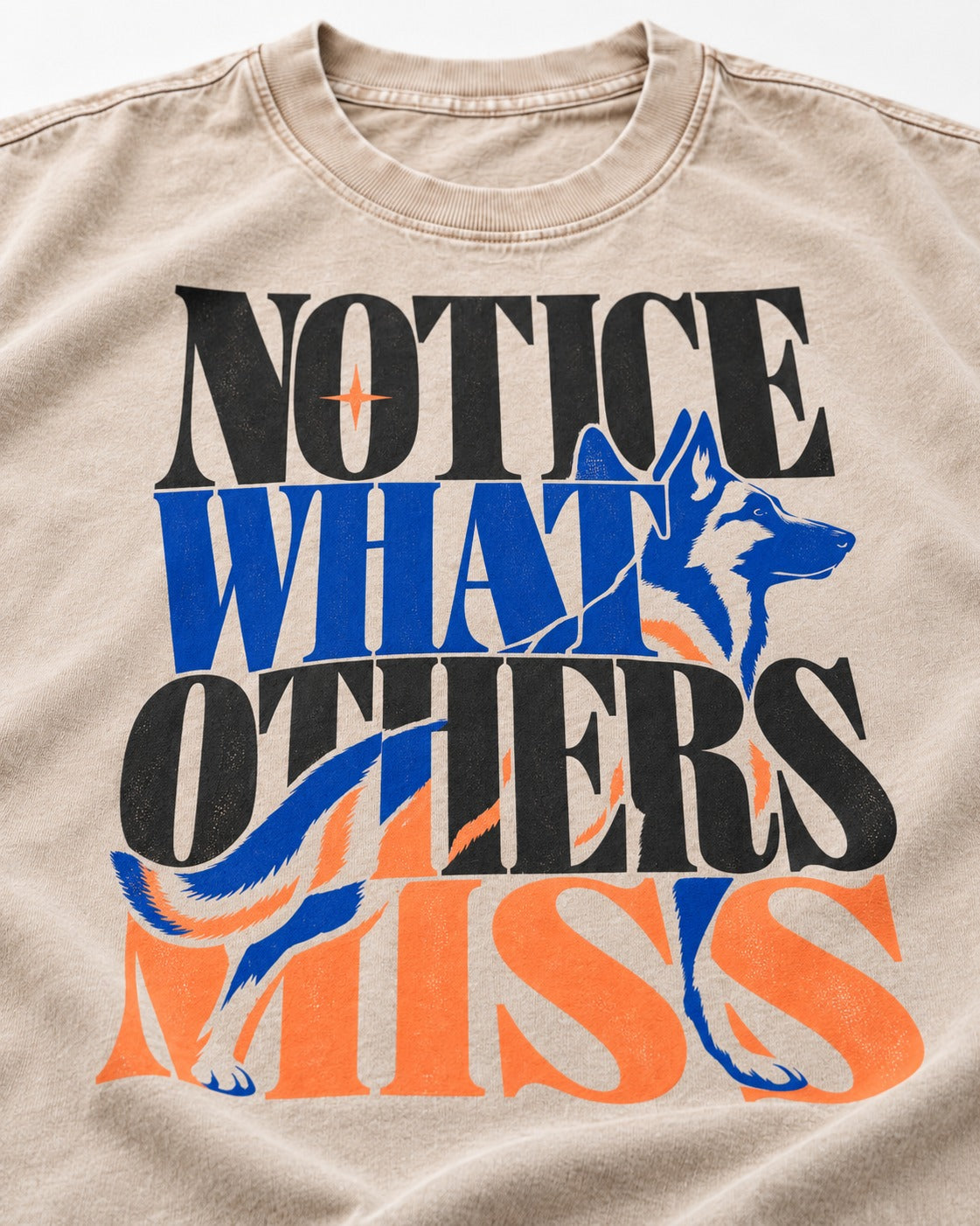 Notice What Others Miss German Shepherd Dog Washed Tee in Apricot, close-up of the graphic