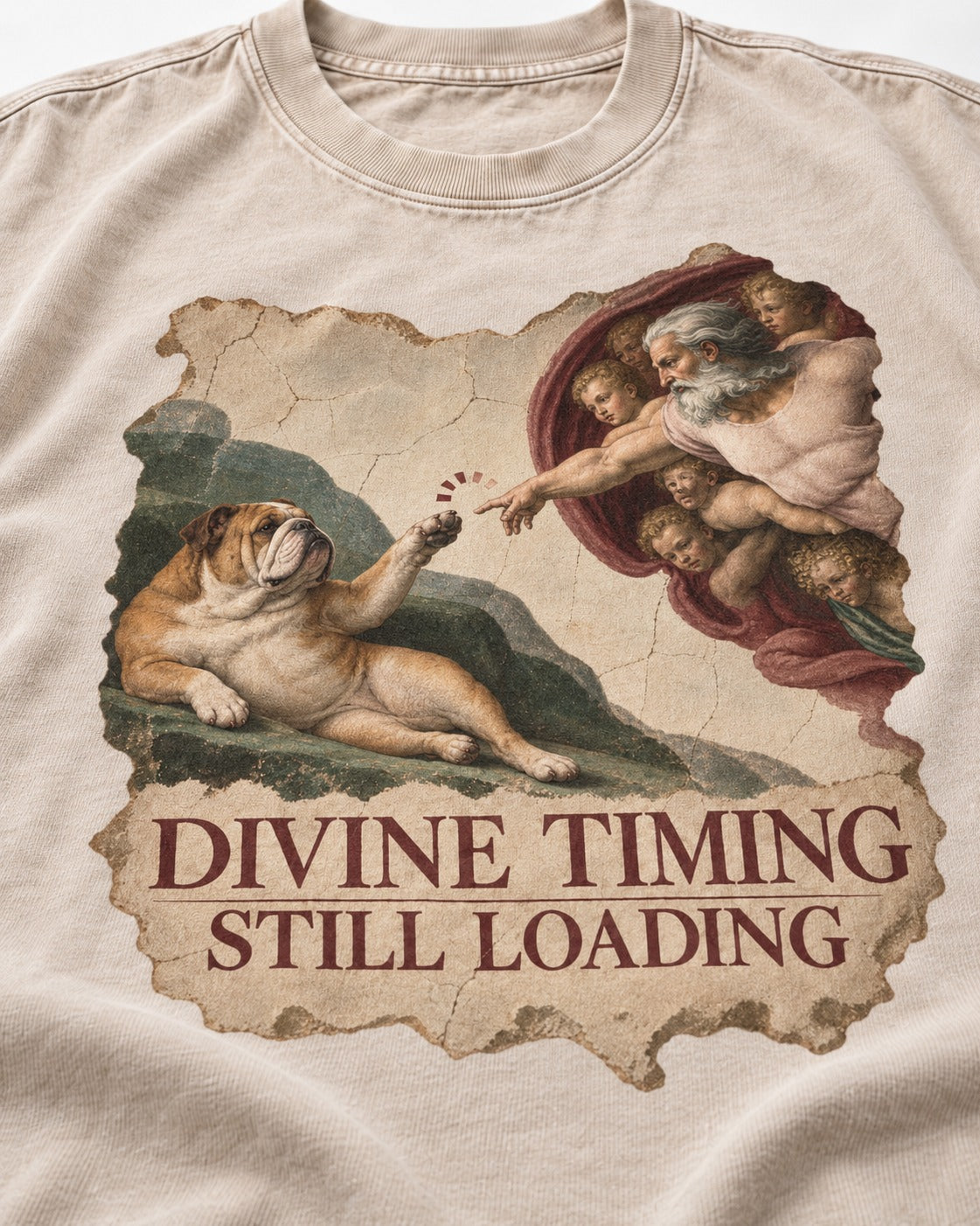 English Bulldog Divine Timing Still Loading Washed Tee in Apricot, close-up of the graphic