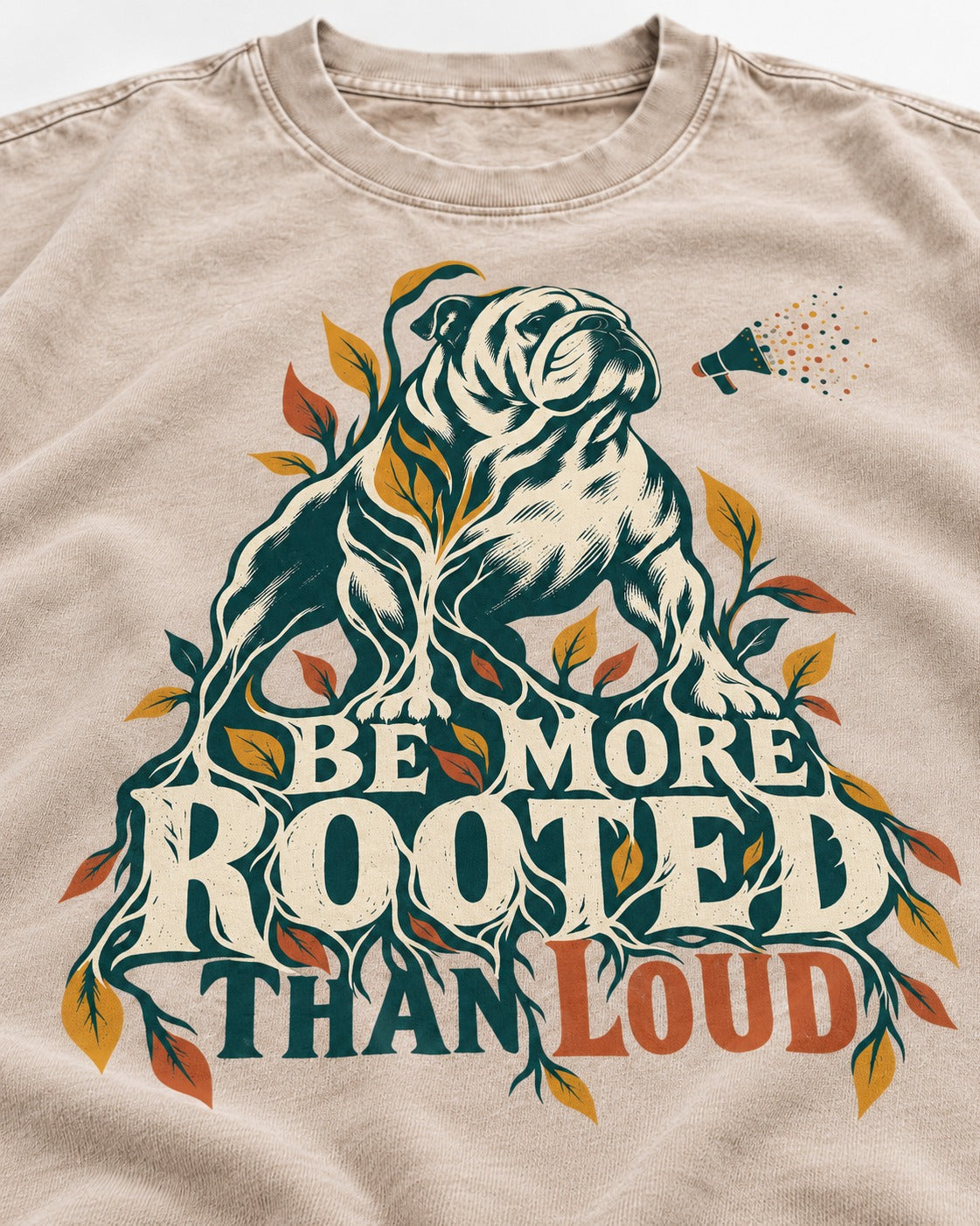 More Rooted Than Loud English Bulldog Washed Tee in Apricot, close-up of the graphic