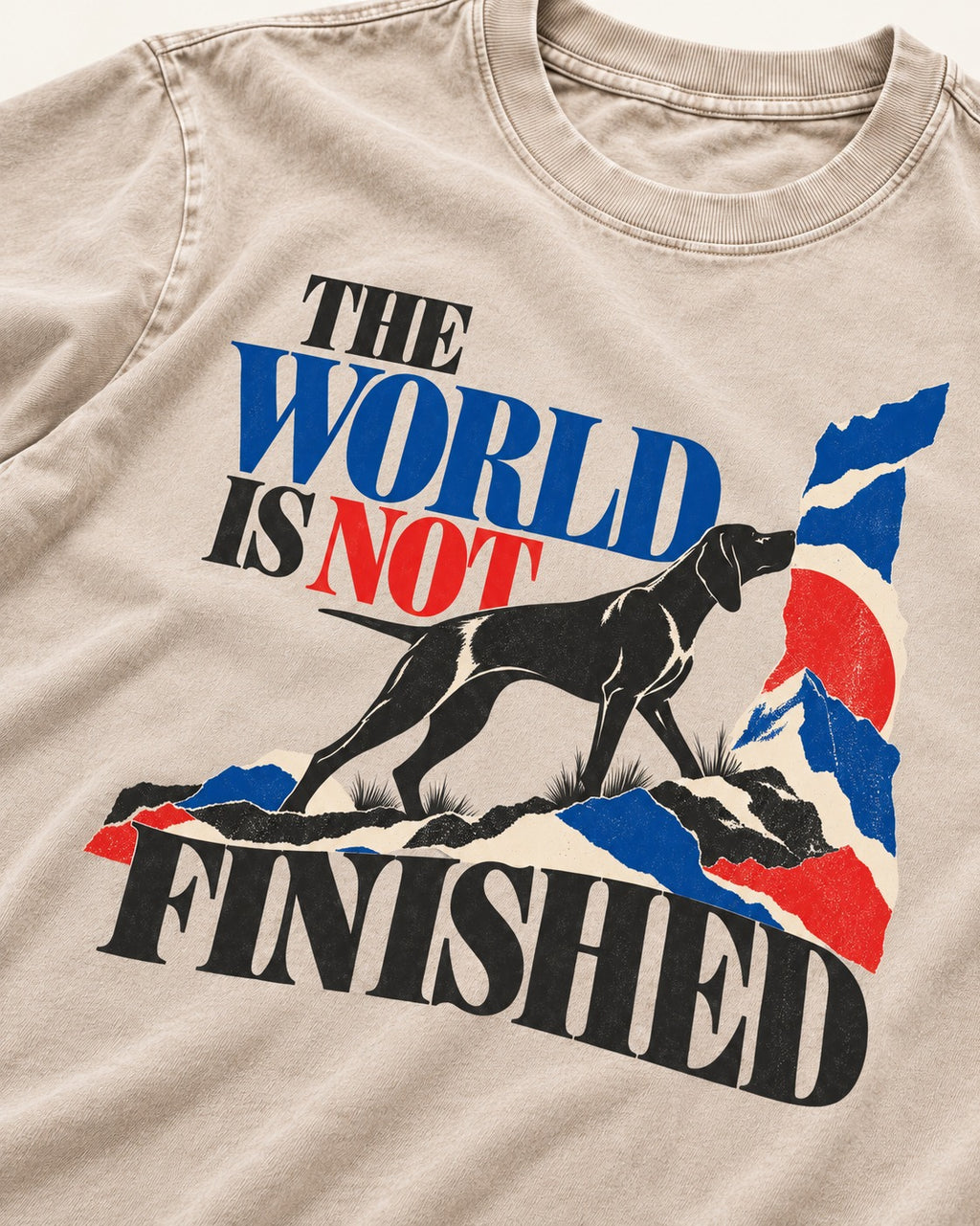 World Is Not Finished German Shorthaired Pointer Washed Tee in Apricot, close-up of the graphic