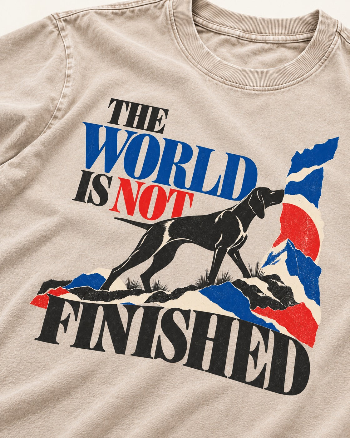 World Is Not Finished German Shorthaired Pointer Washed Tee in Apricot, close-up of the graphic