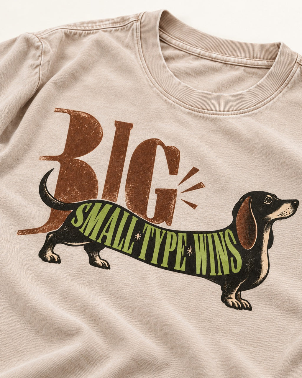 Dachshund Small Type Wins Washed Tee in Apricot, close-up of the graphic