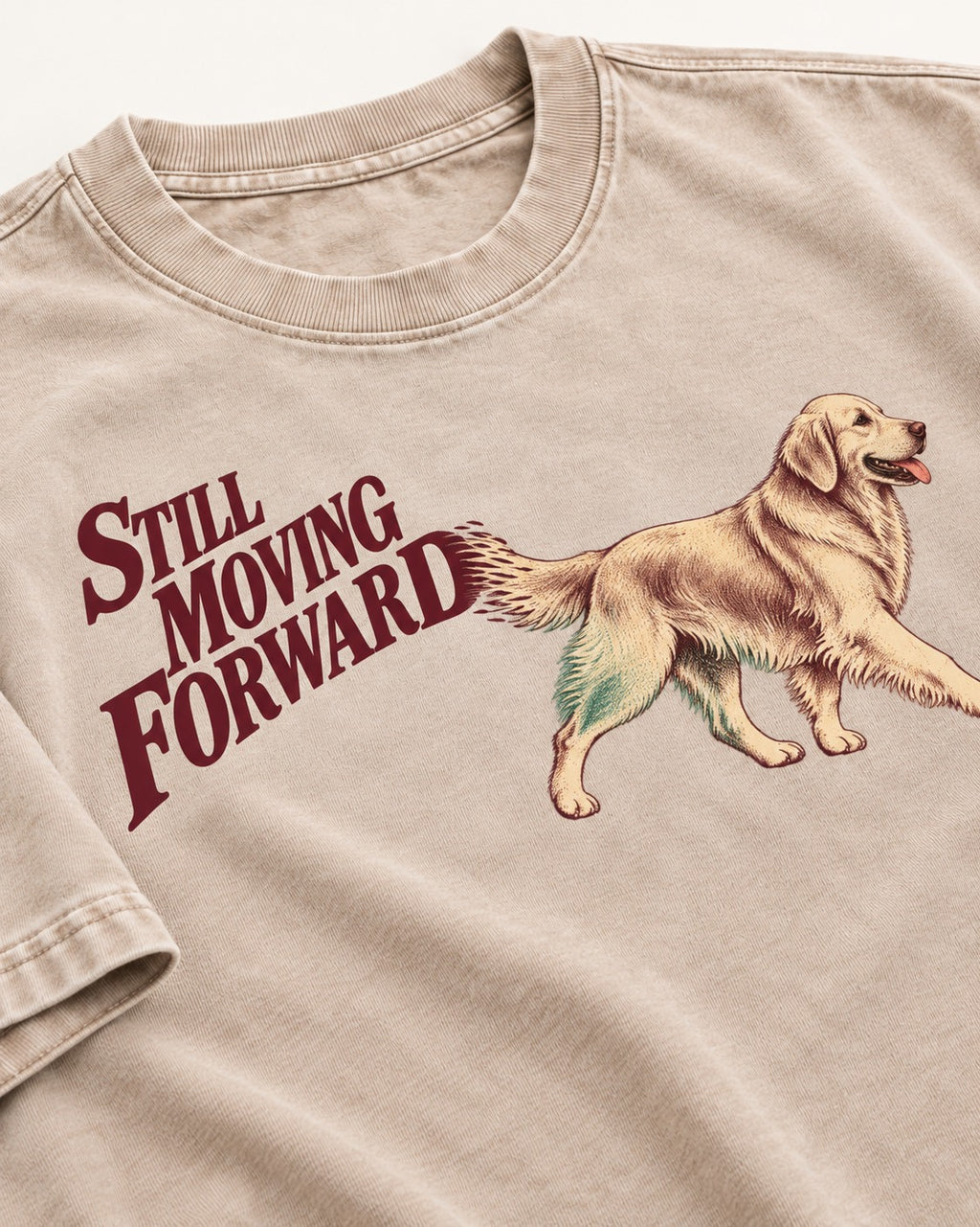 Golden Retriever Still Moving Forward Washed Tee in Apricot, close-up of the graphic