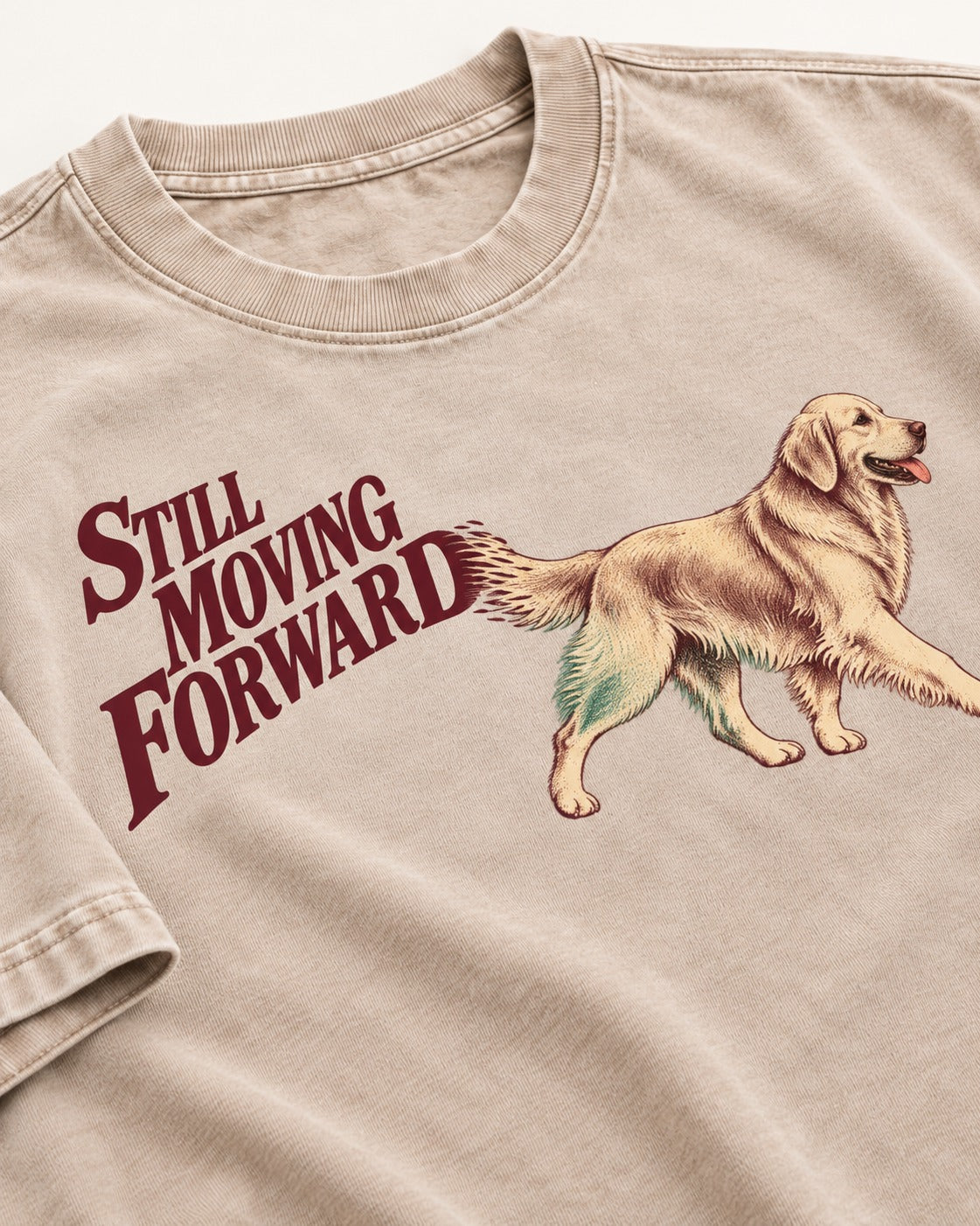 Golden Retriever Still Moving Forward Washed Tee in Apricot, close-up of the graphic
