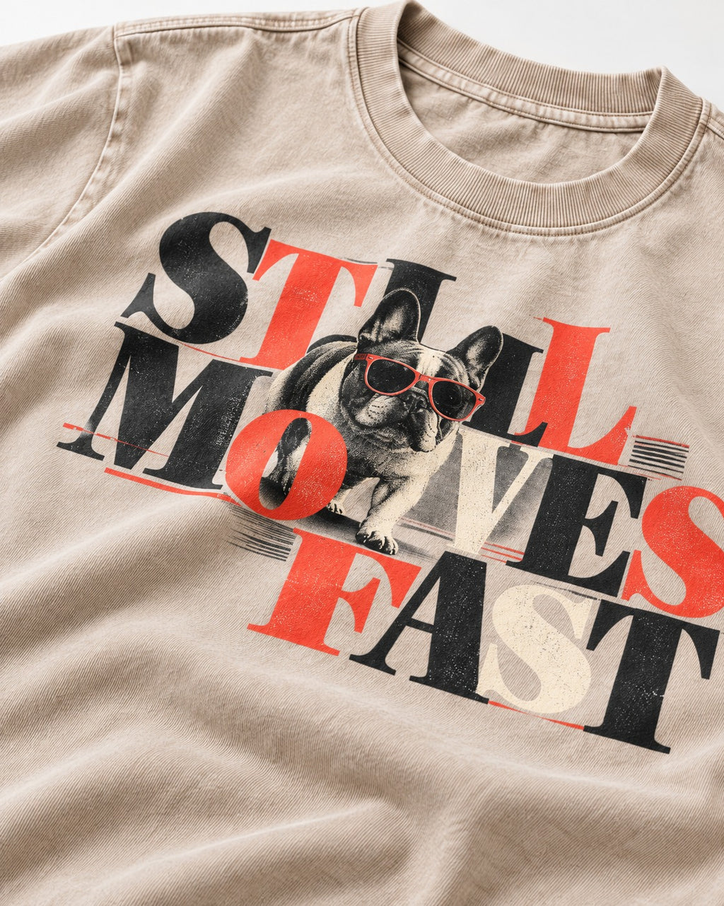 Frenchie Still Moves Fast Washed Tee in Apricot, close-up of the graphic