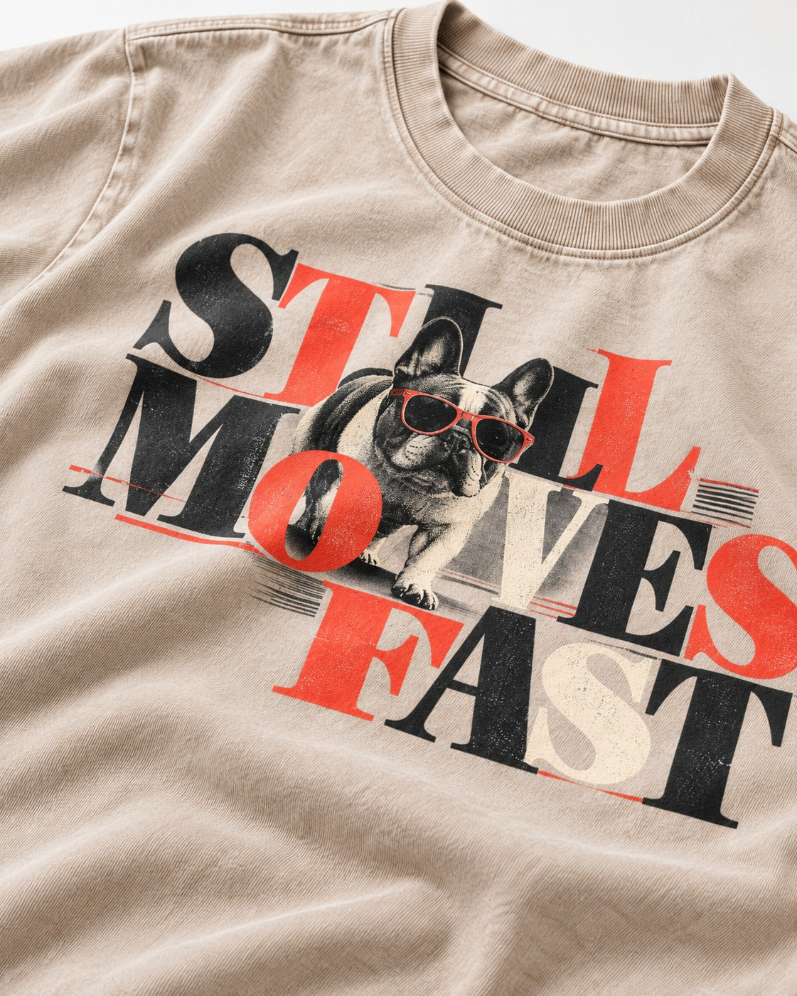 Frenchie Still Moves Fast Washed Tee in Apricot, close-up of the graphic