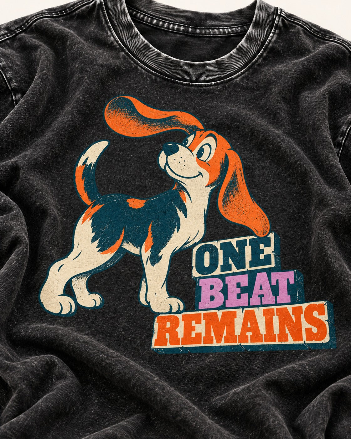 Retro Beagle One Beat Remains Washed Tee in Black, close-up of the graphic