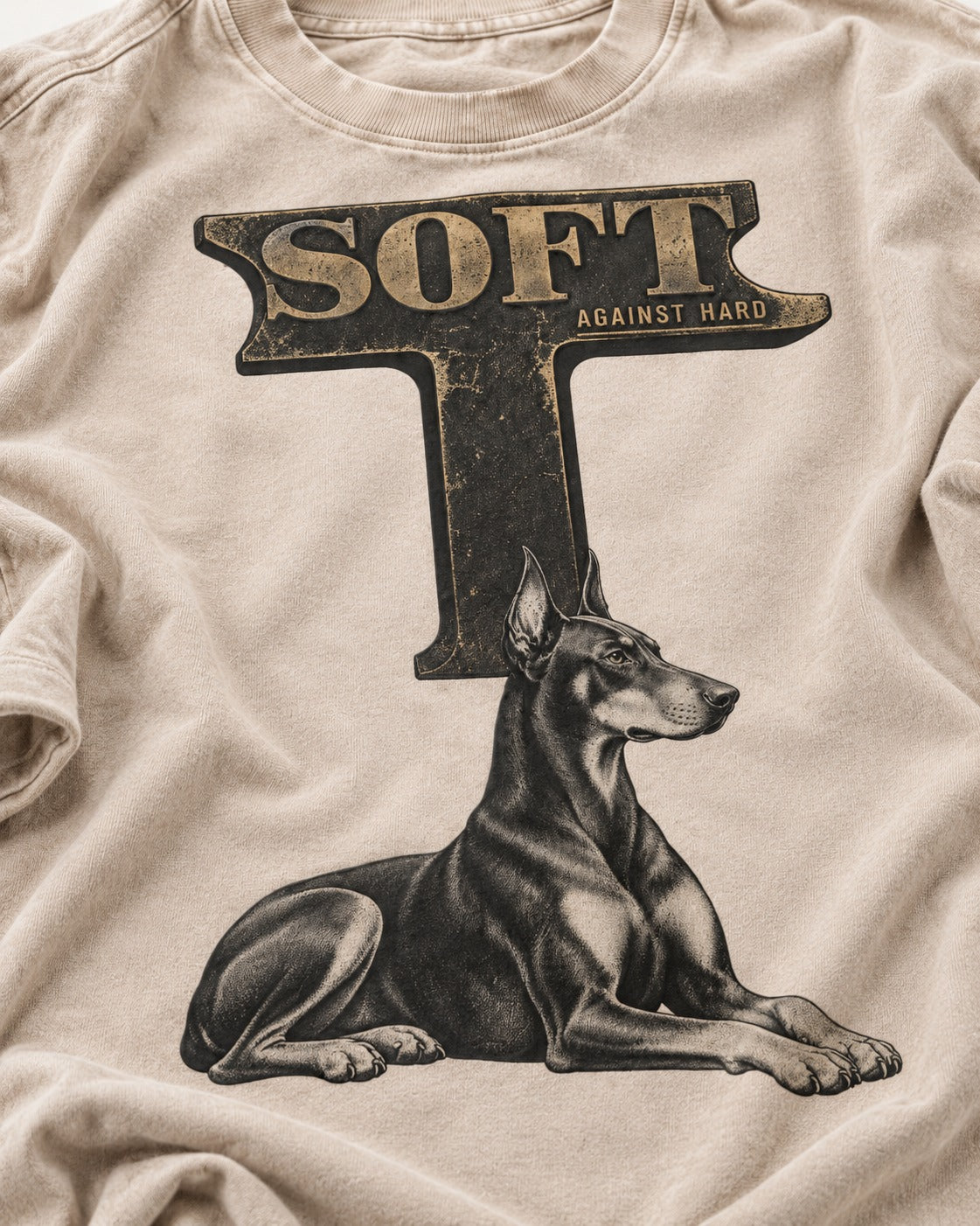 Soft Against Hard Doberman Washed Tee in Apricot, close-up of the graphic