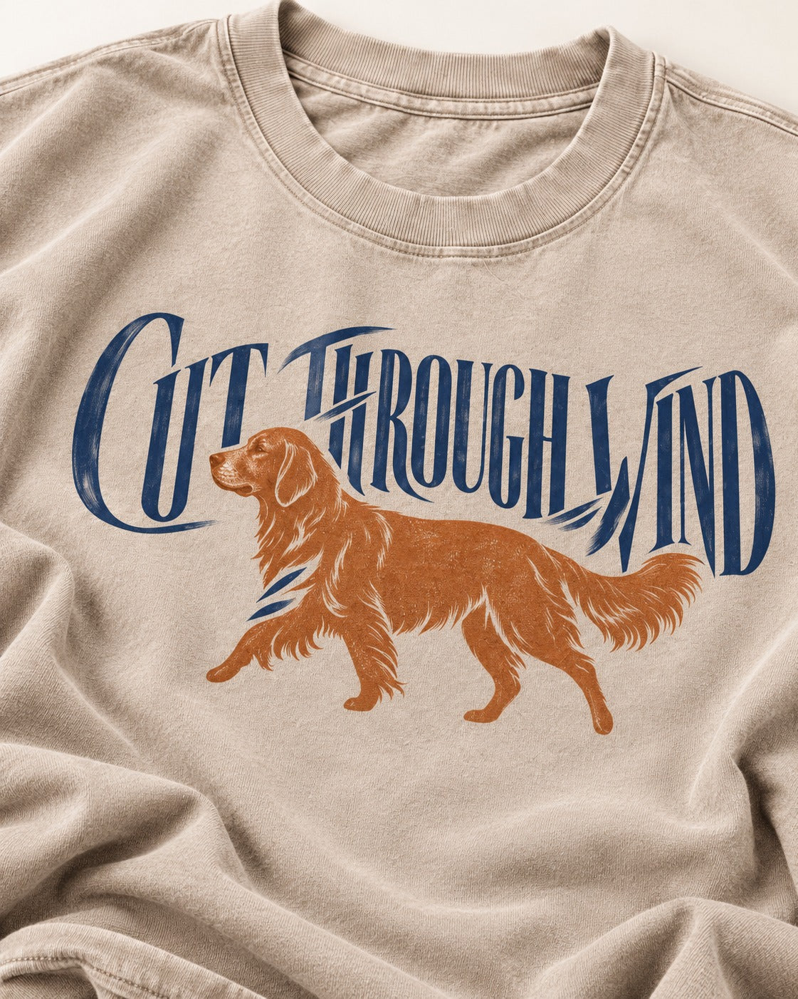 Golden Retriever Cut Through Land Washed Tee in Apricot, close-up of the graphic