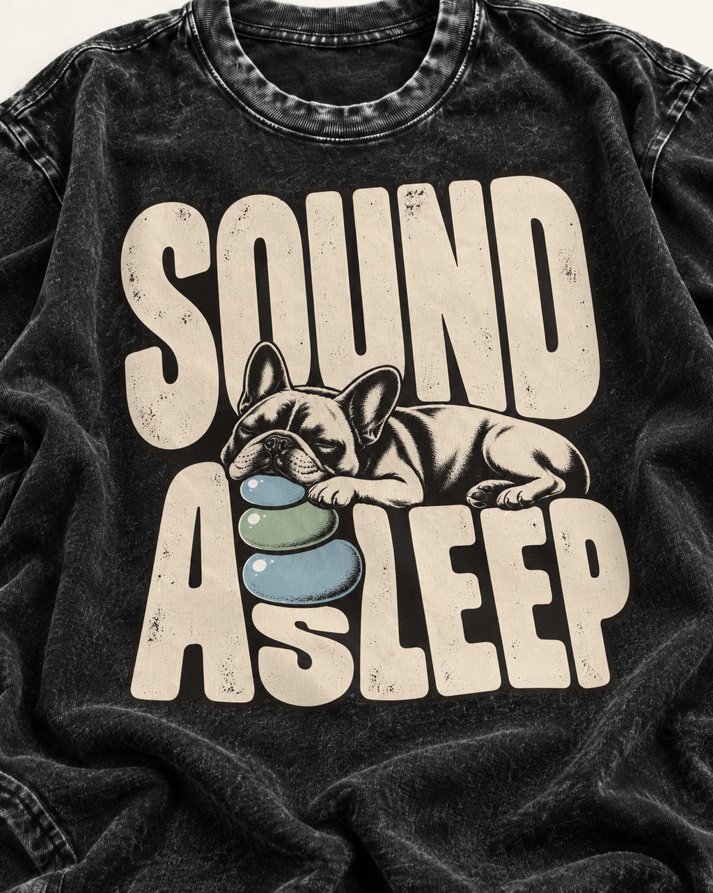 Frenchie Sound Asleep Stone Pillow Graphic Washed Tee in Black, close-up of the graphic