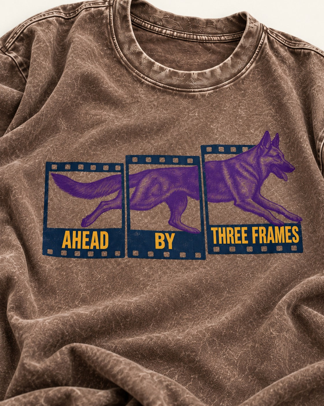 German Shepherd Dog Ahead by Three Frames Washed Tee in Coffee, close-up of the graphic