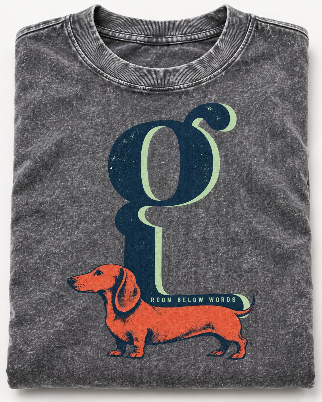 Dachshund Room Below Words Lowercase G Graphic Washed Tee in Gray, close-up of the graphic