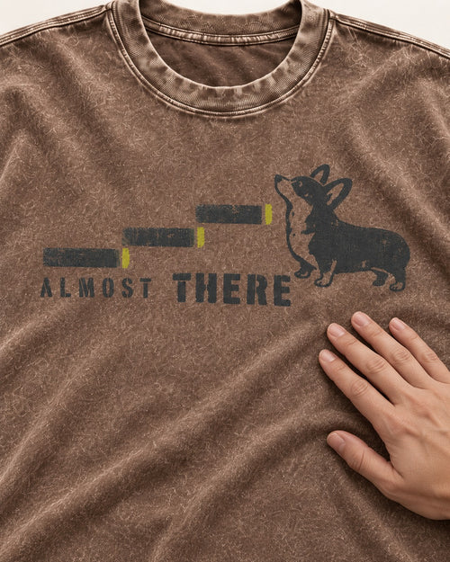 Almost There Corgi Washed Tee in Coffee, close-up of the graphic