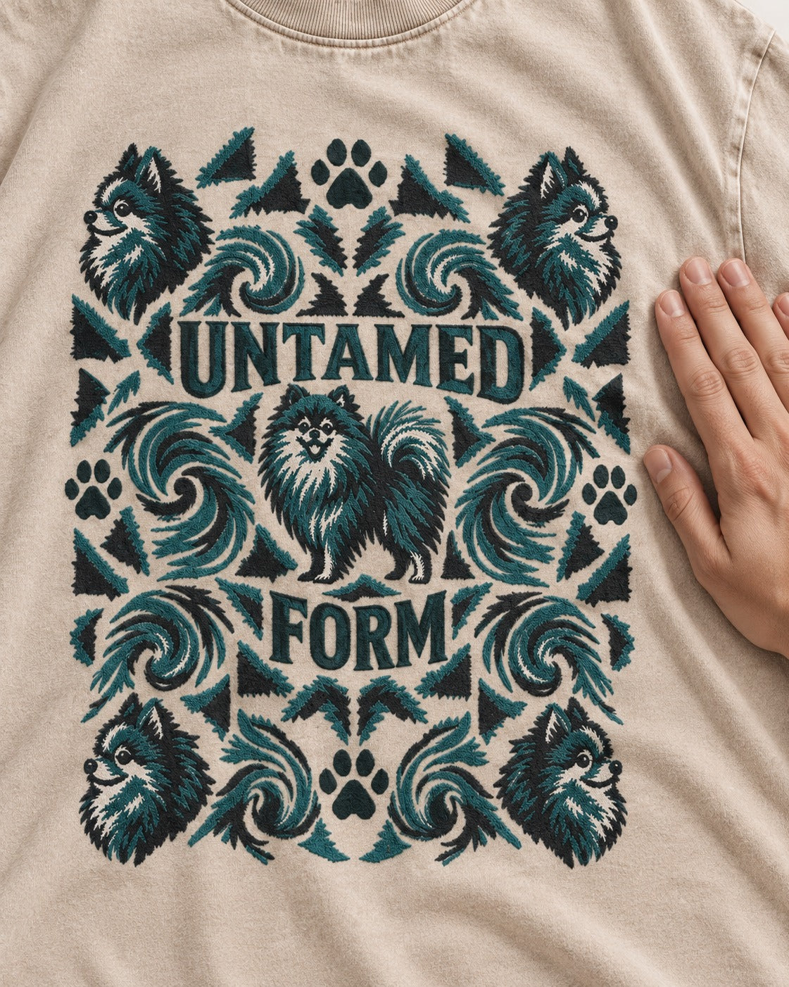 Pomeranian Untamed Form Washed Tee in Apricot, close-up of the graphic