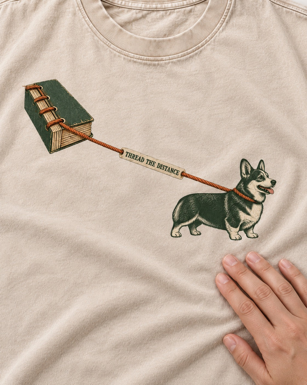 Thread the Distance with Corgi Washed Tee in Apricot, close-up of the graphic