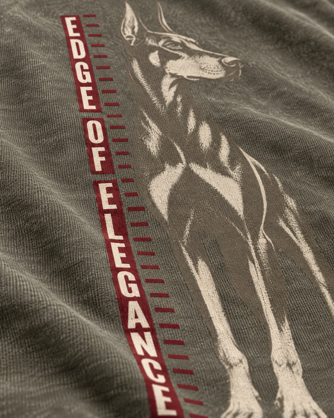 Doberman Edge of Elegance Height Chart Graphic Washed Tee in Army Green, close-up of the graphic