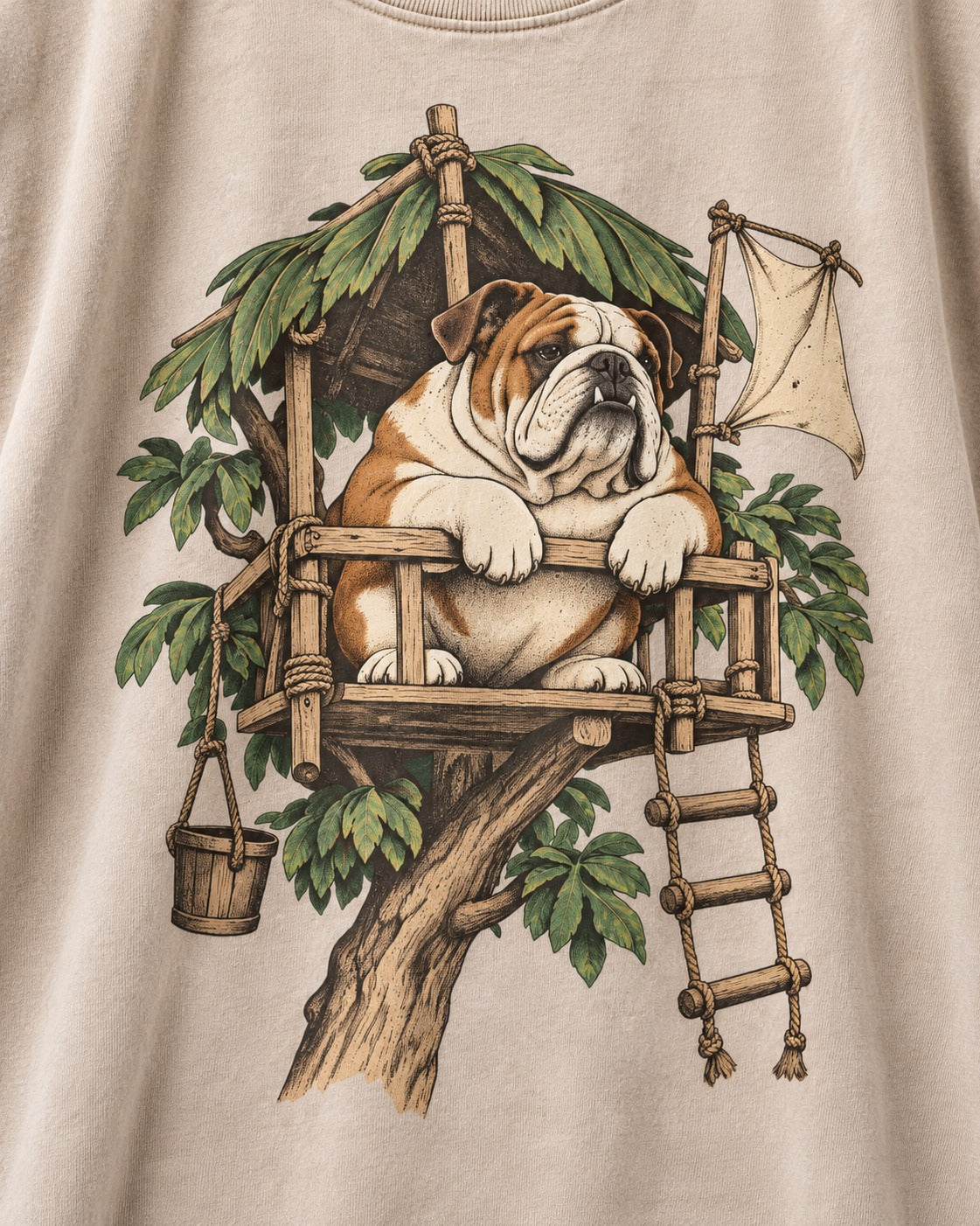 English Bulldog Above It All Washed Tee in Apricot, close-up of the graphic