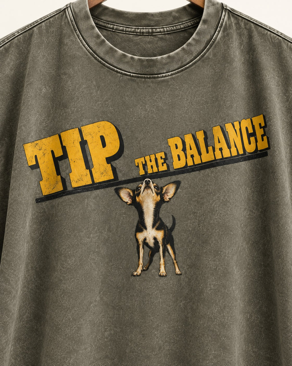 Chihuahua Tip the Balance Beam Graphic Washed Tee in Army Green, close-up of the graphic