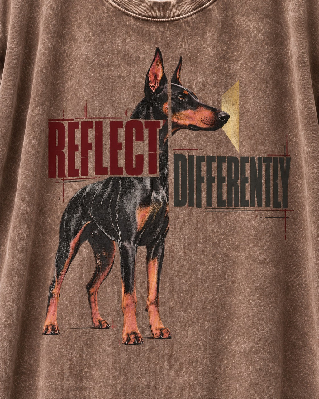 Doberman Reflects Differently Washed Tee in Coffee, close-up of the graphic