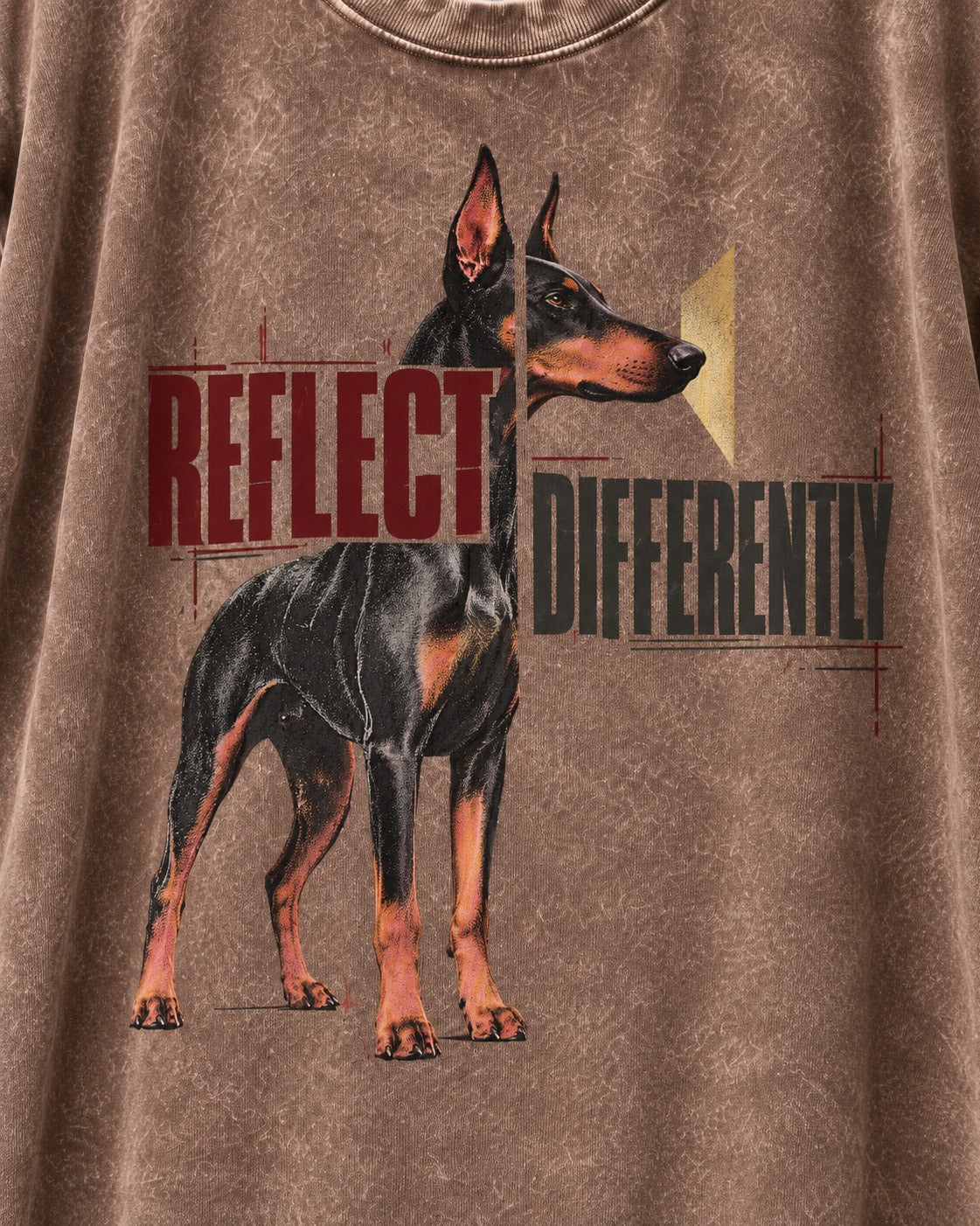 Doberman Reflects Differently Washed Tee in Coffee, close-up of the graphic