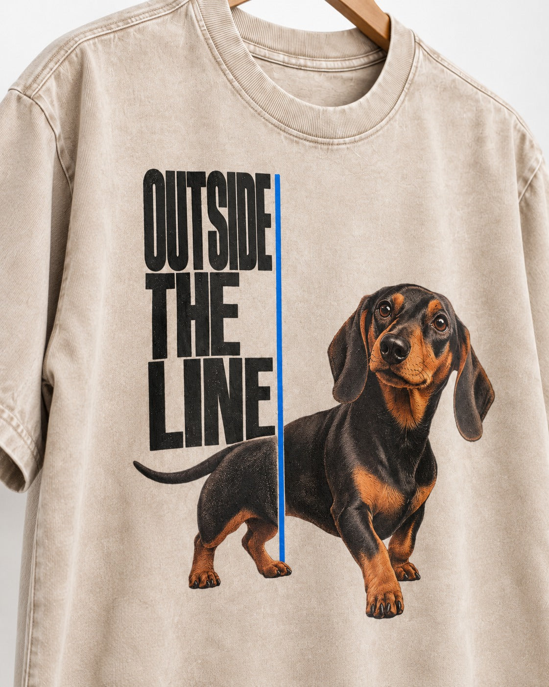 Dachshund Outside the Line Washed Tee in Apricot, close-up of the graphic