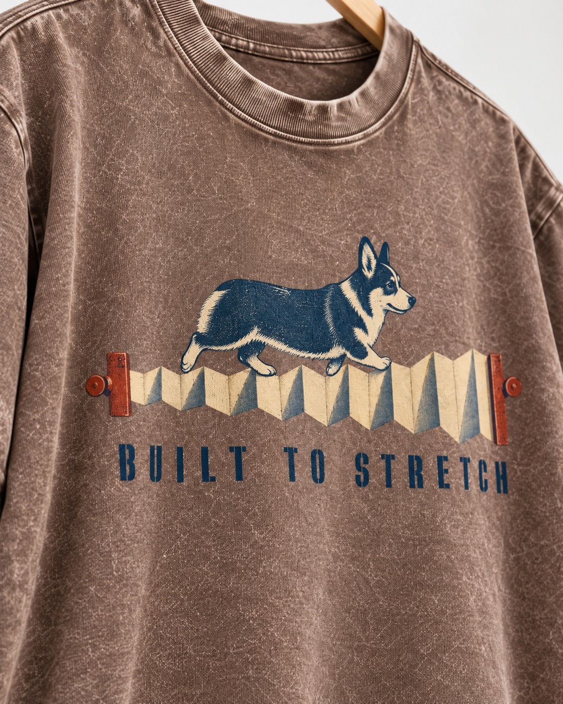 Corgi Built to Stretch Accordion Graphic Washed Tee in Coffee, close-up of the graphic